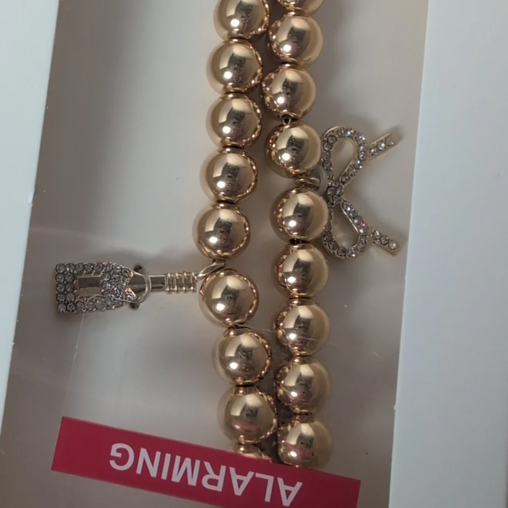 BaubleBar Champagne Celebration Themed Phone Charm Wristlet Gold Tone & Crystal